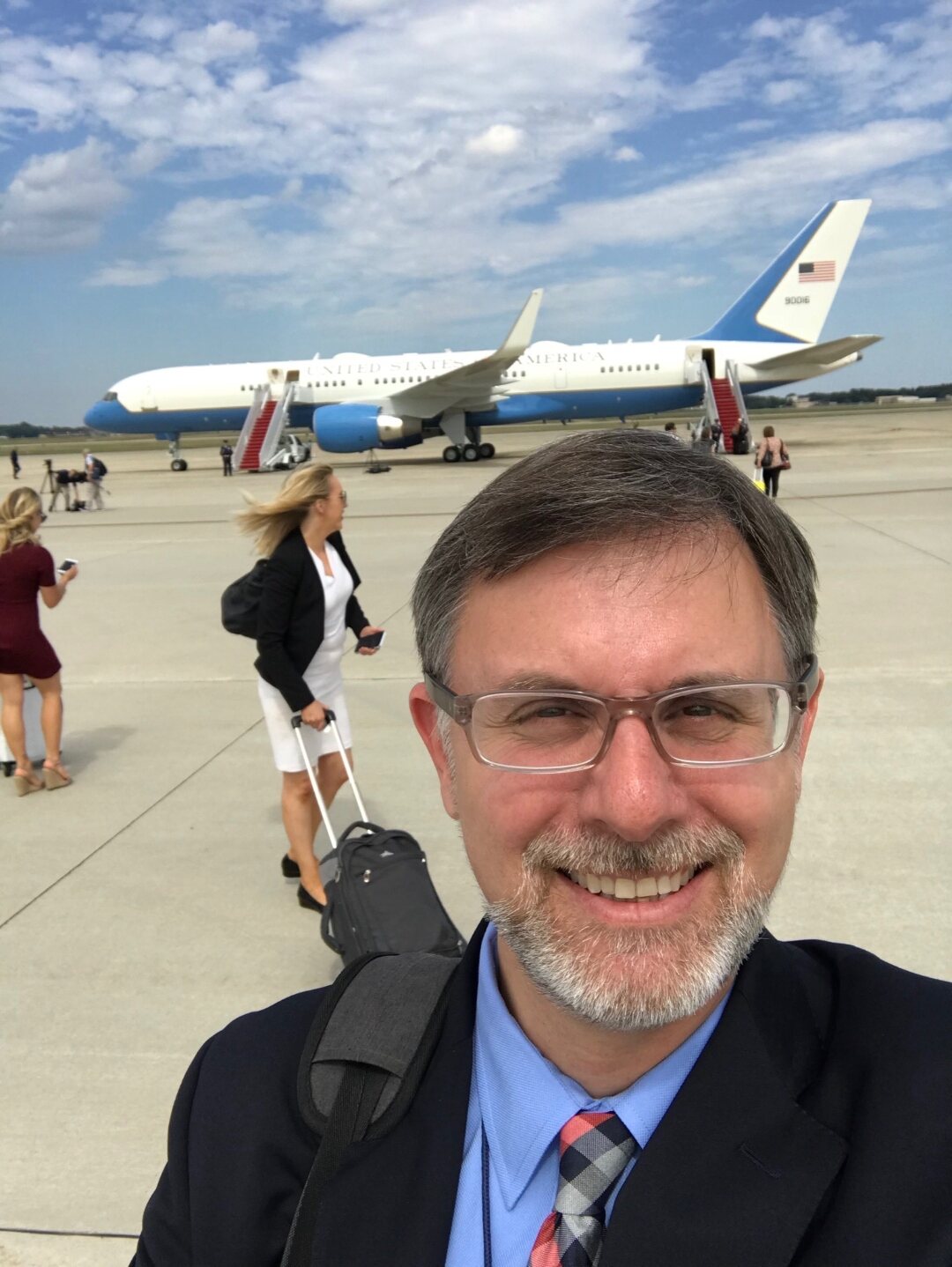 Michael D. Shear on an airport tarmac